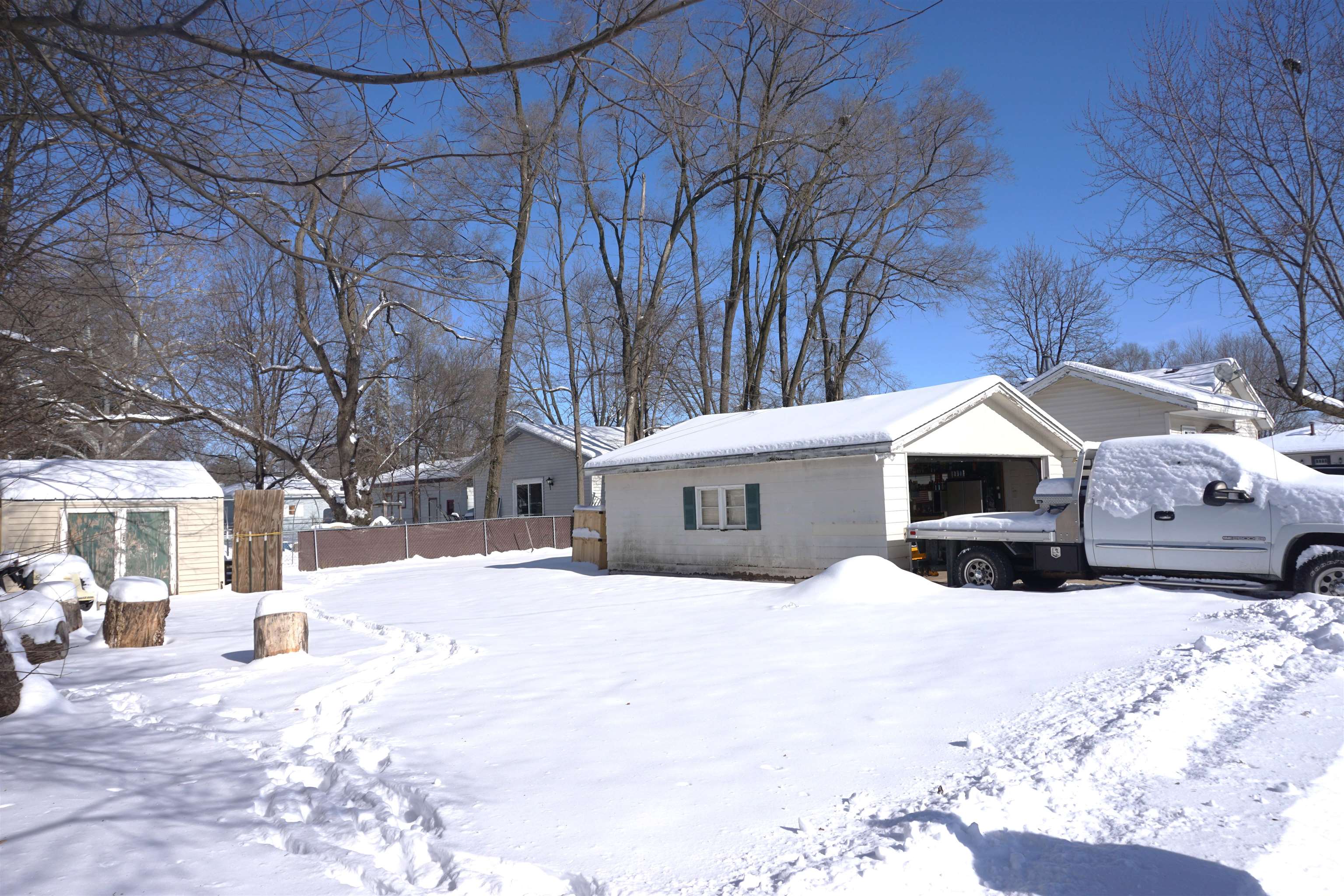 7402 Randy Road Machesney Park, IL 61115 - Photo 20 of 23 a street view covered with snow in front of house