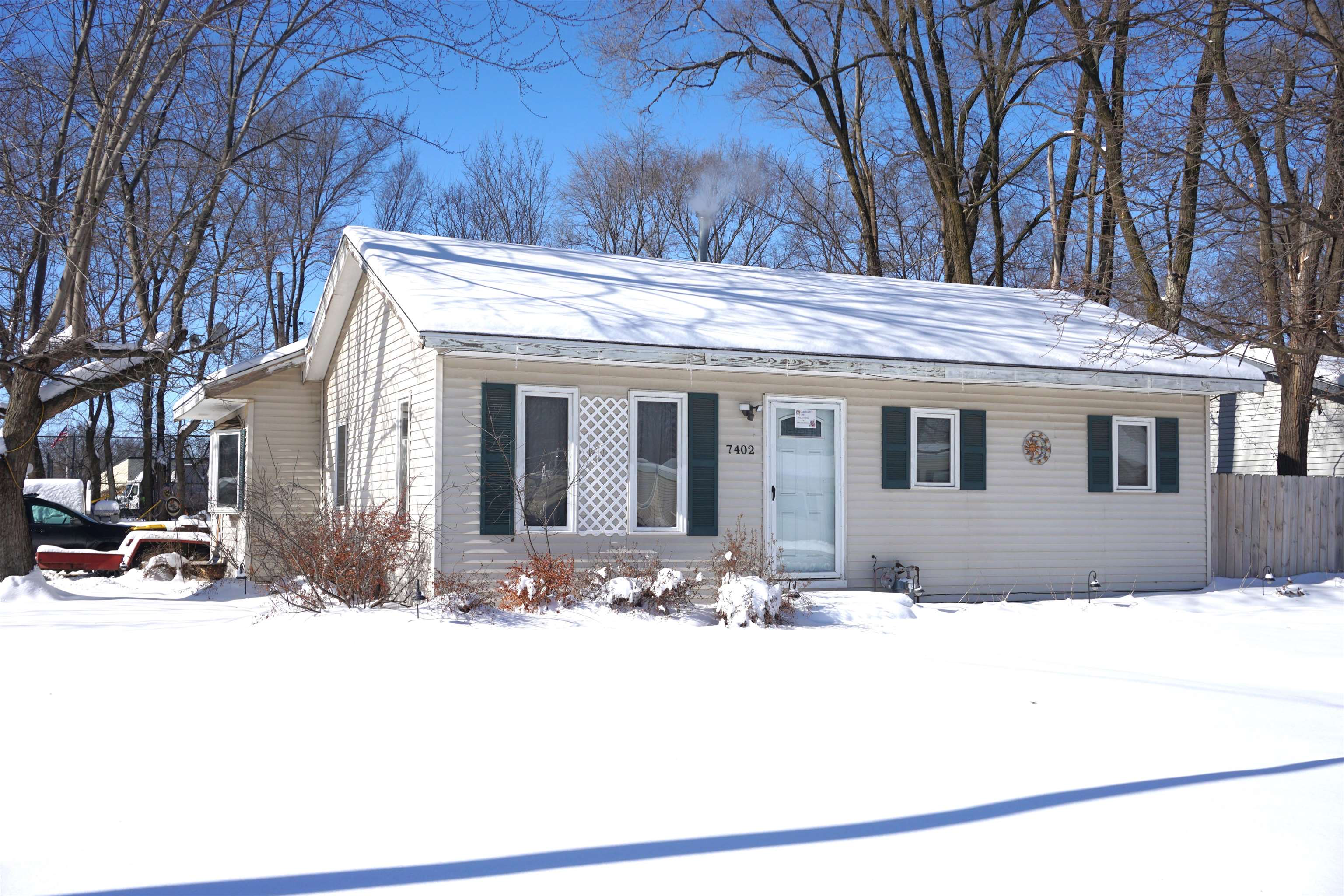 7402 Randy Road Machesney Park, IL 61115 - Photo 3 of 23 a view of house with snow on the road