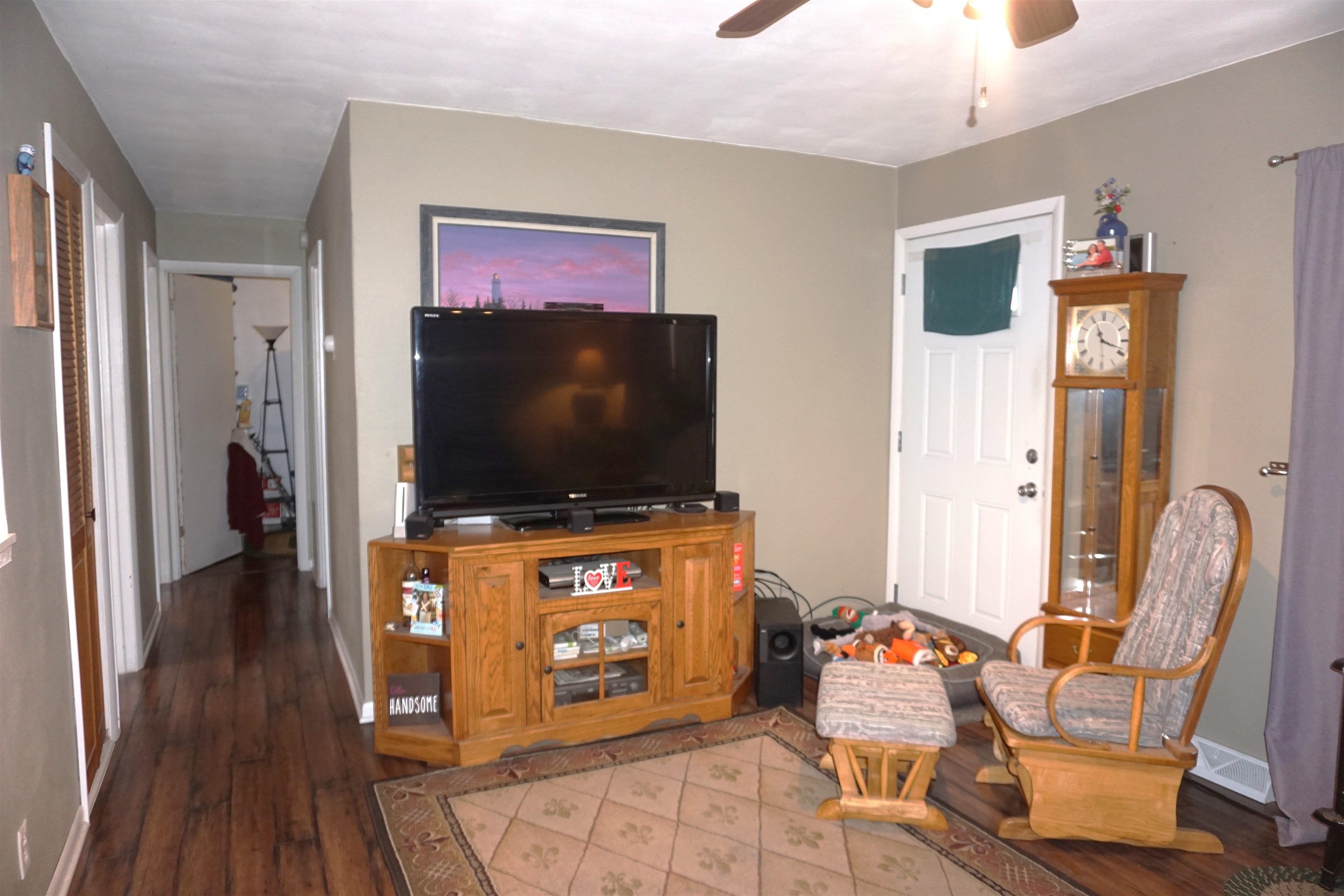 7402 Randy Road Machesney Park, IL 61115 - Photo 5 of 23 a living room with furniture and a flat screen tv