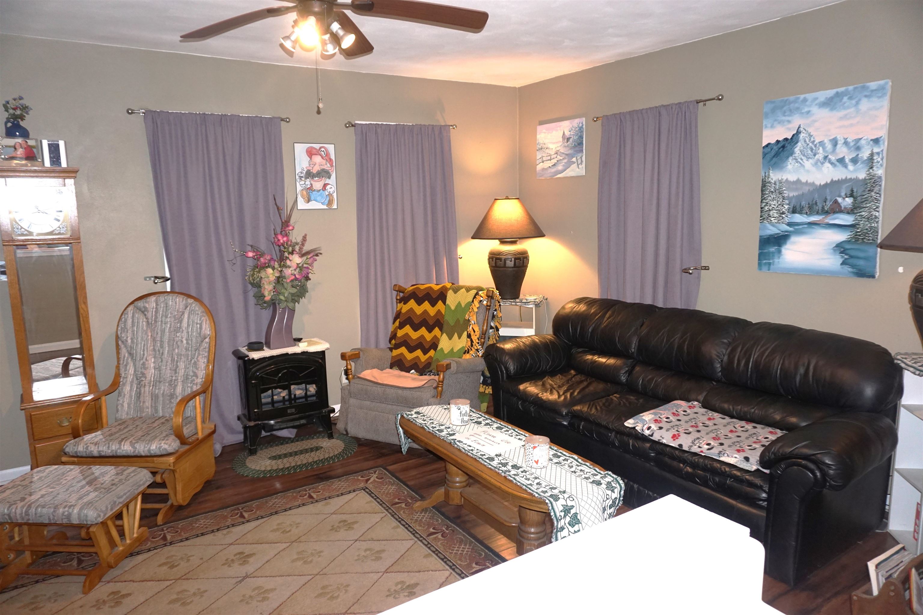 7402 Randy Road Machesney Park, IL 61115 - Photo 6 of 23 a living room with furniture flowerpot and window