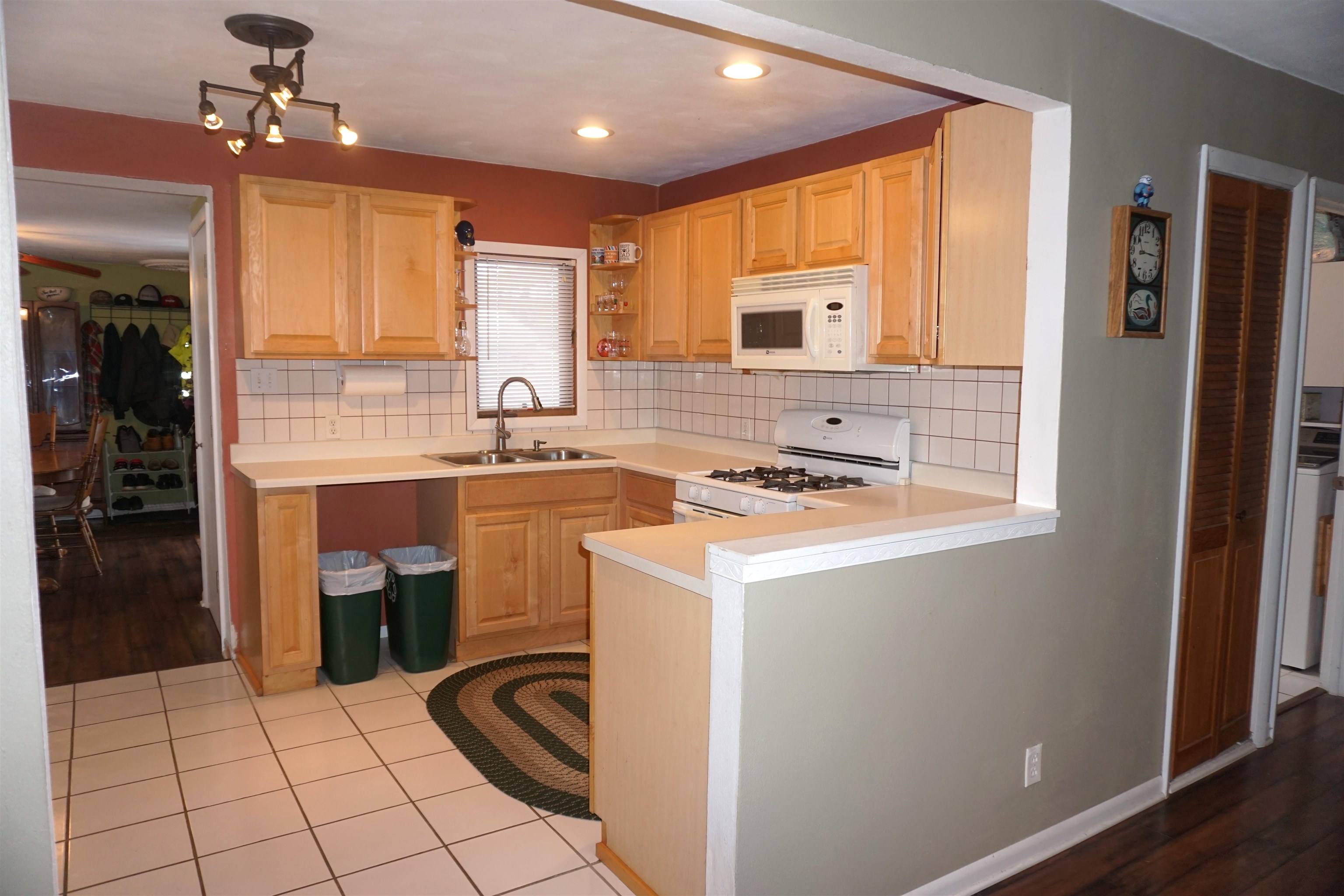 7402 Randy Road Machesney Park, IL 61115 - Photo 7 of 23 a kitchen that has a sink and a refrigerator