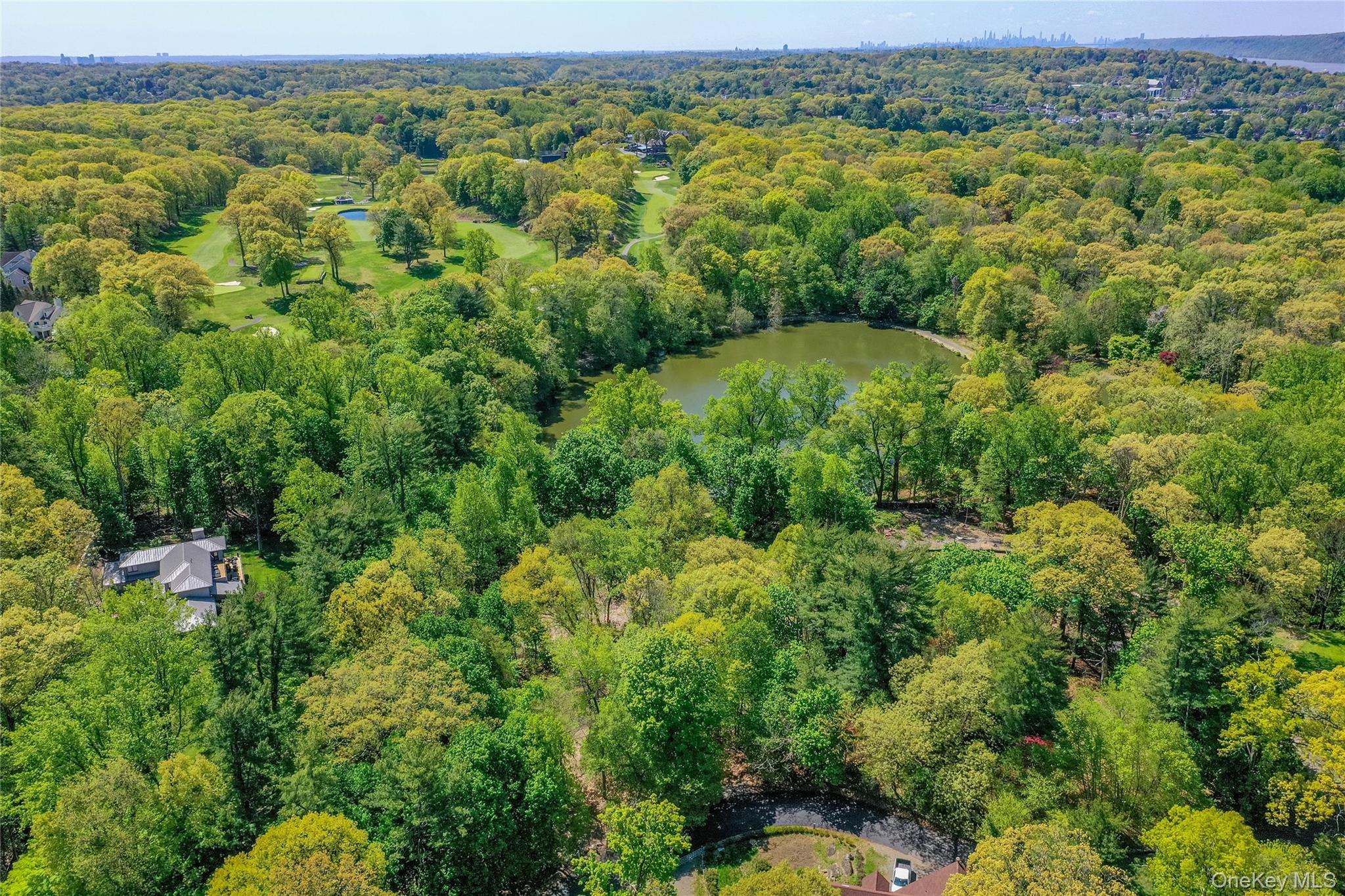 Lot #1 Castle Road Irvington, NY 10533 - Photo 16 of 26 an aerial view of a houses with a lush green hillside