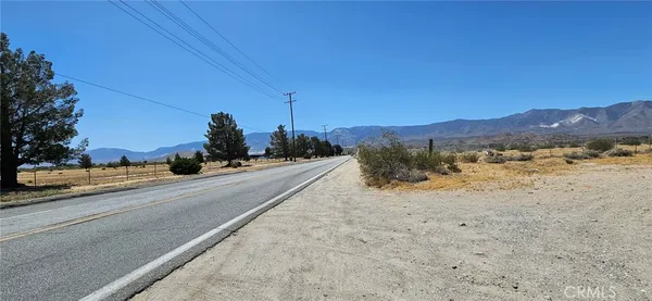 a view of a road with a yard
