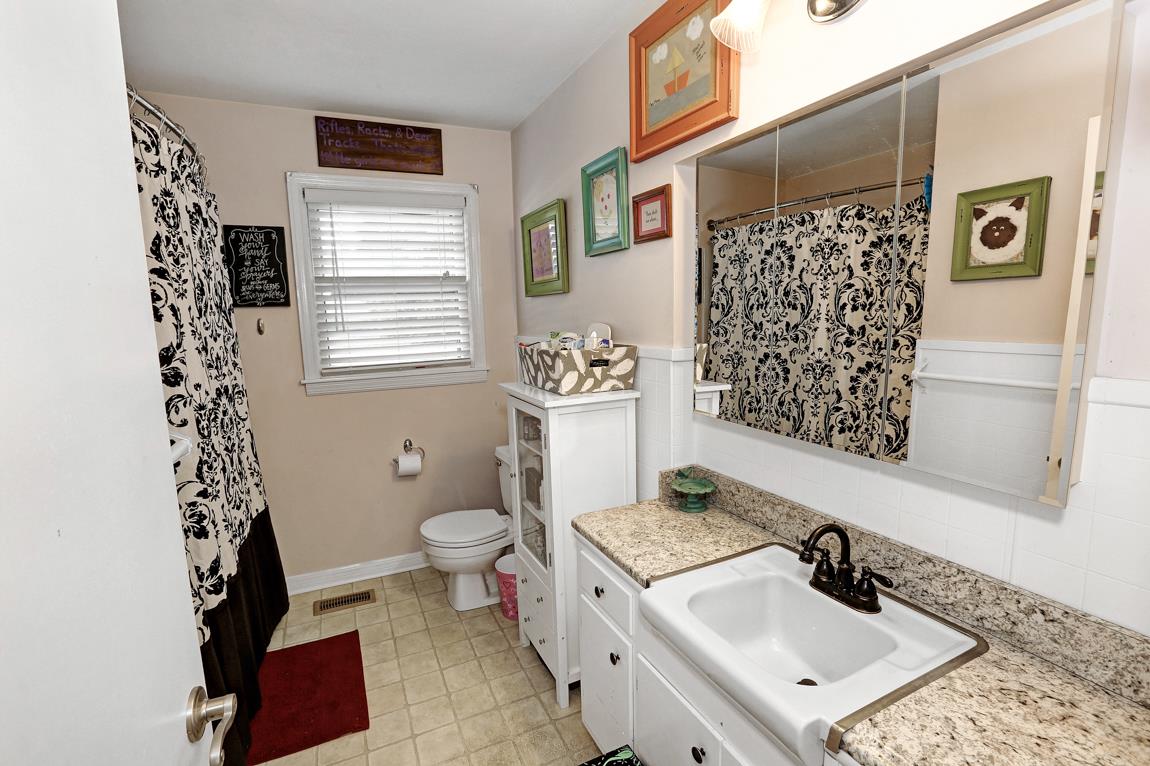 23164 Black Road Athens, AL 35613 - Photo 17 of 26 a bathroom with a sink toilet and shower