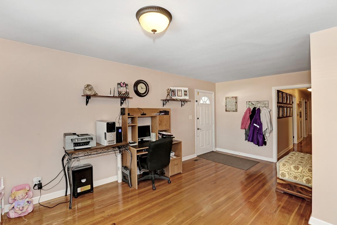 23164 Black Road Athens, AL 35613 - Photo 3 of 26 a view of a workspace with furniture and wooden floor