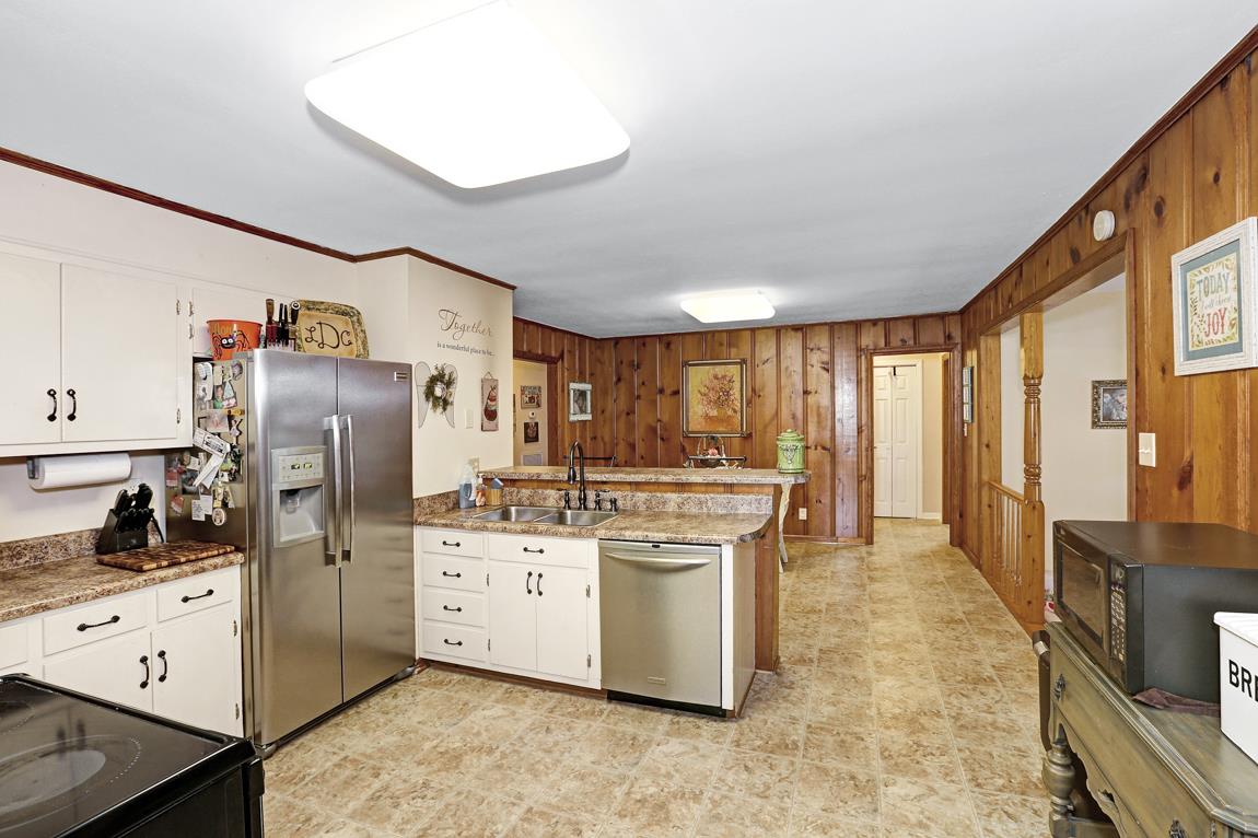 23164 Black Road Athens, AL 35613 - Photo 8 of 26 a kitchen with stainless steel appliances a stove refrigerator sink and cabinets