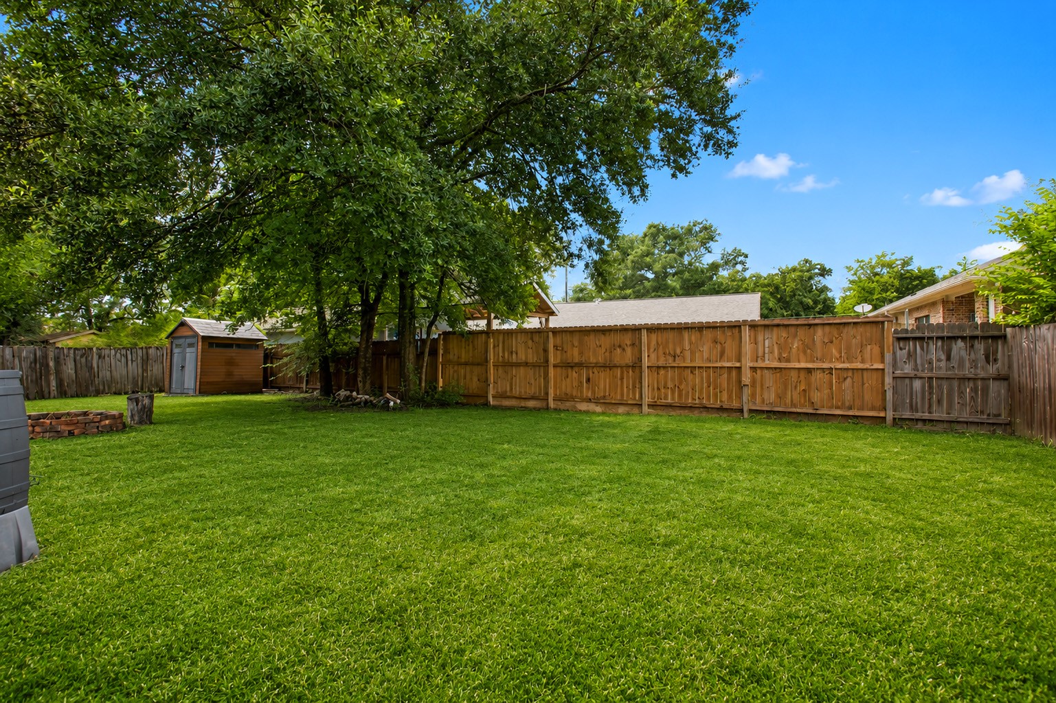 312 Springwood Drive Conroe, TX 77385 - Photo 50 of 50 The large backyard provides space to add an outdoor kitchen, pool, garden or a play set for the kids.