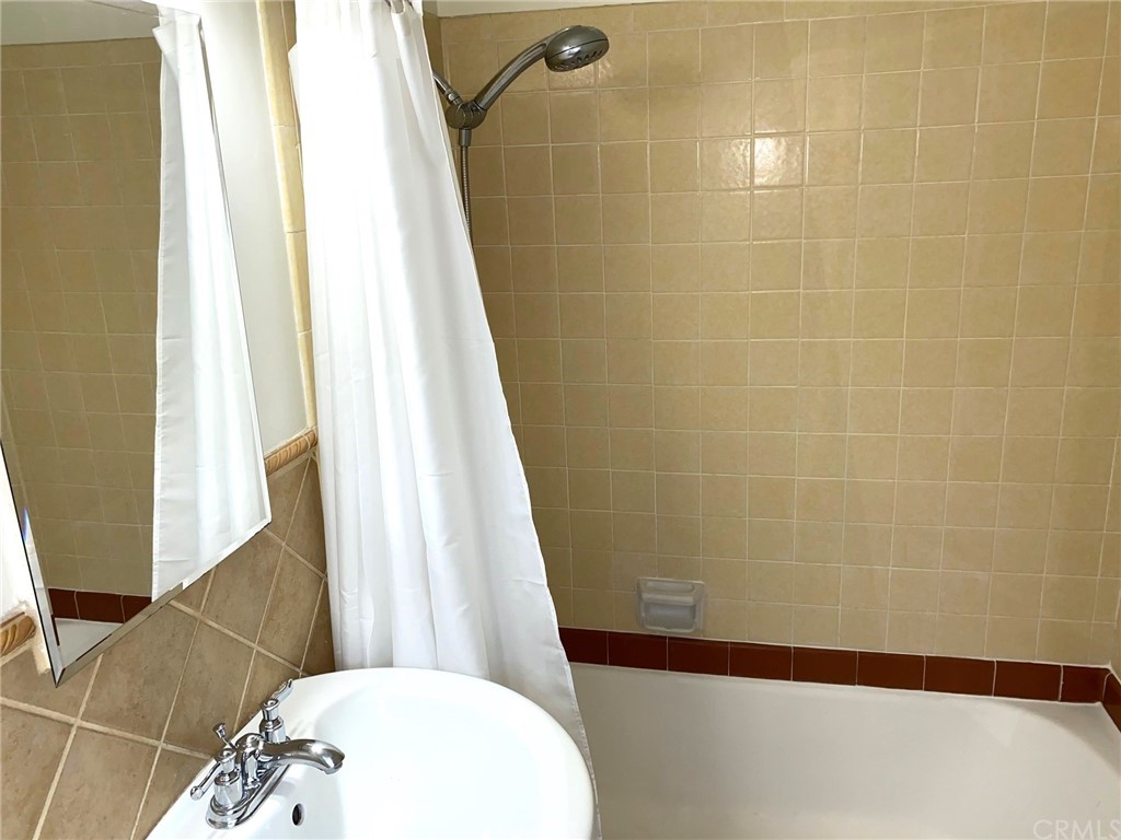 236 La Verne Avenue Long Beach, CA 90803 - Photo 8 of 8 a bathroom with a sink and a mirror