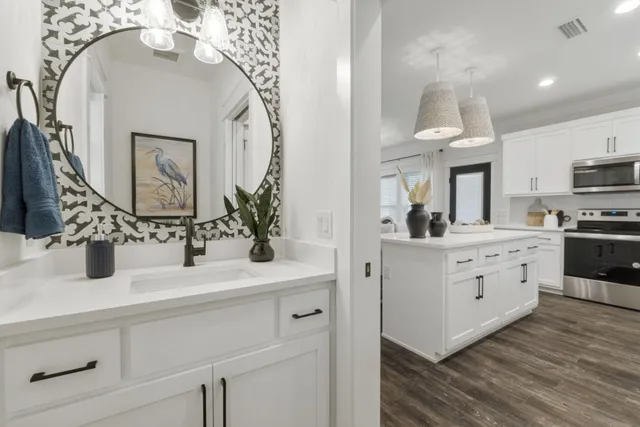 a bathroom with a sink double vanity and a mirror