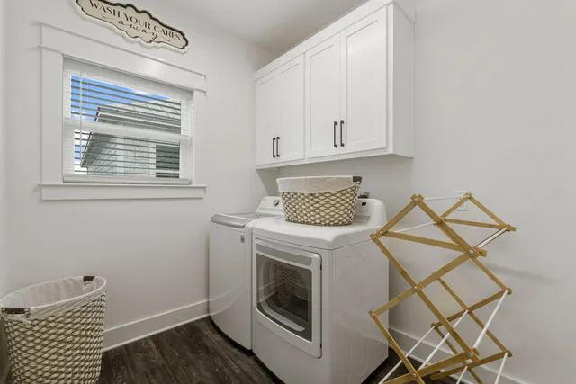 a kitchen with a stove oven and white cabinets