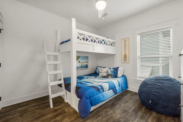 a bedroom with a bed and a chair