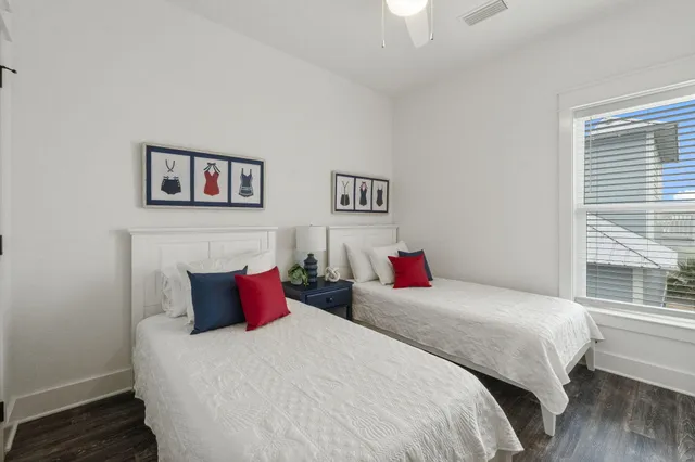 a bedroom with bed and a window