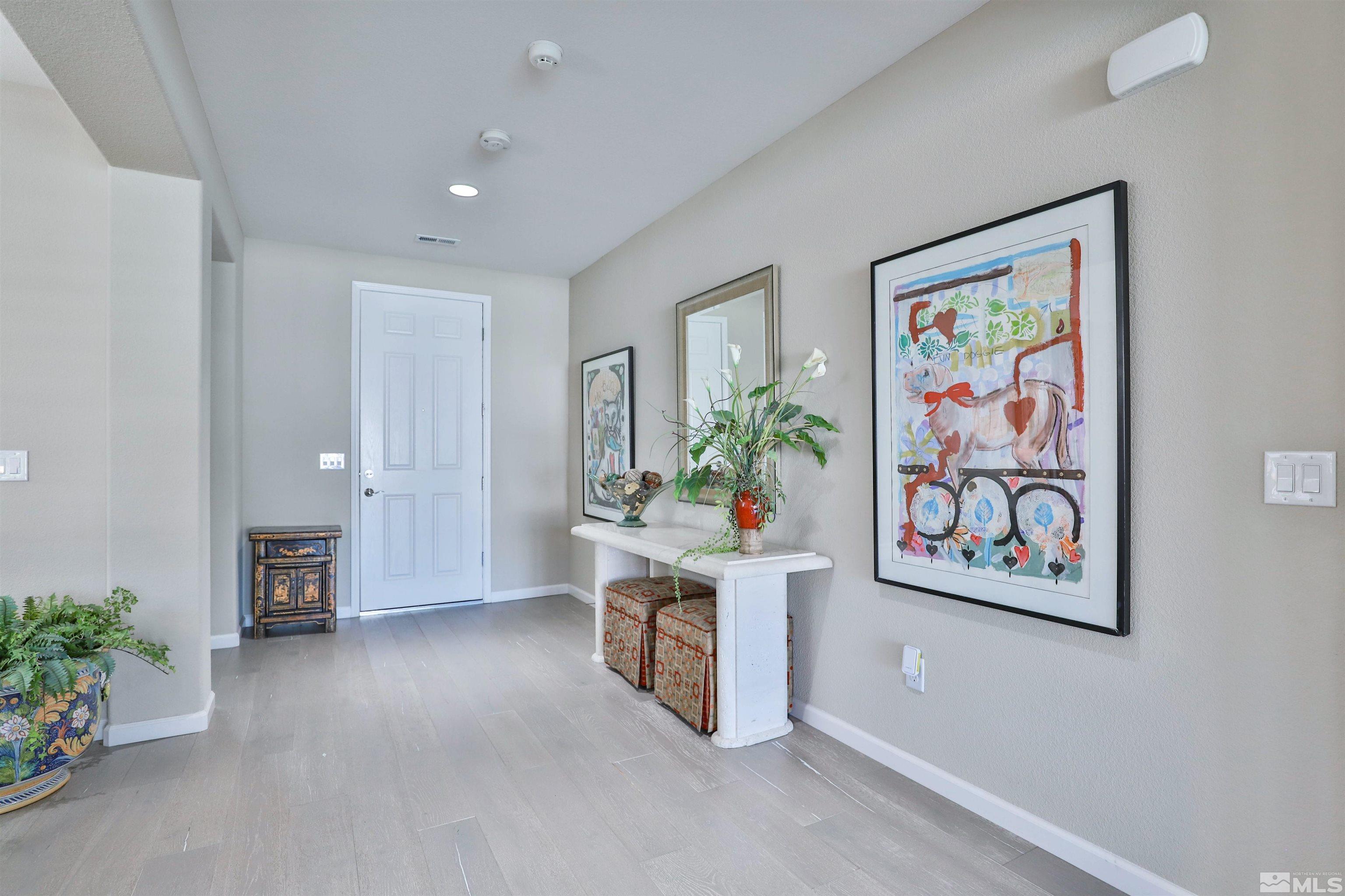 9860 Shadowless Trail Reno, NV 89521 - Photo 4 of 31 a room with furniture and a potted plant