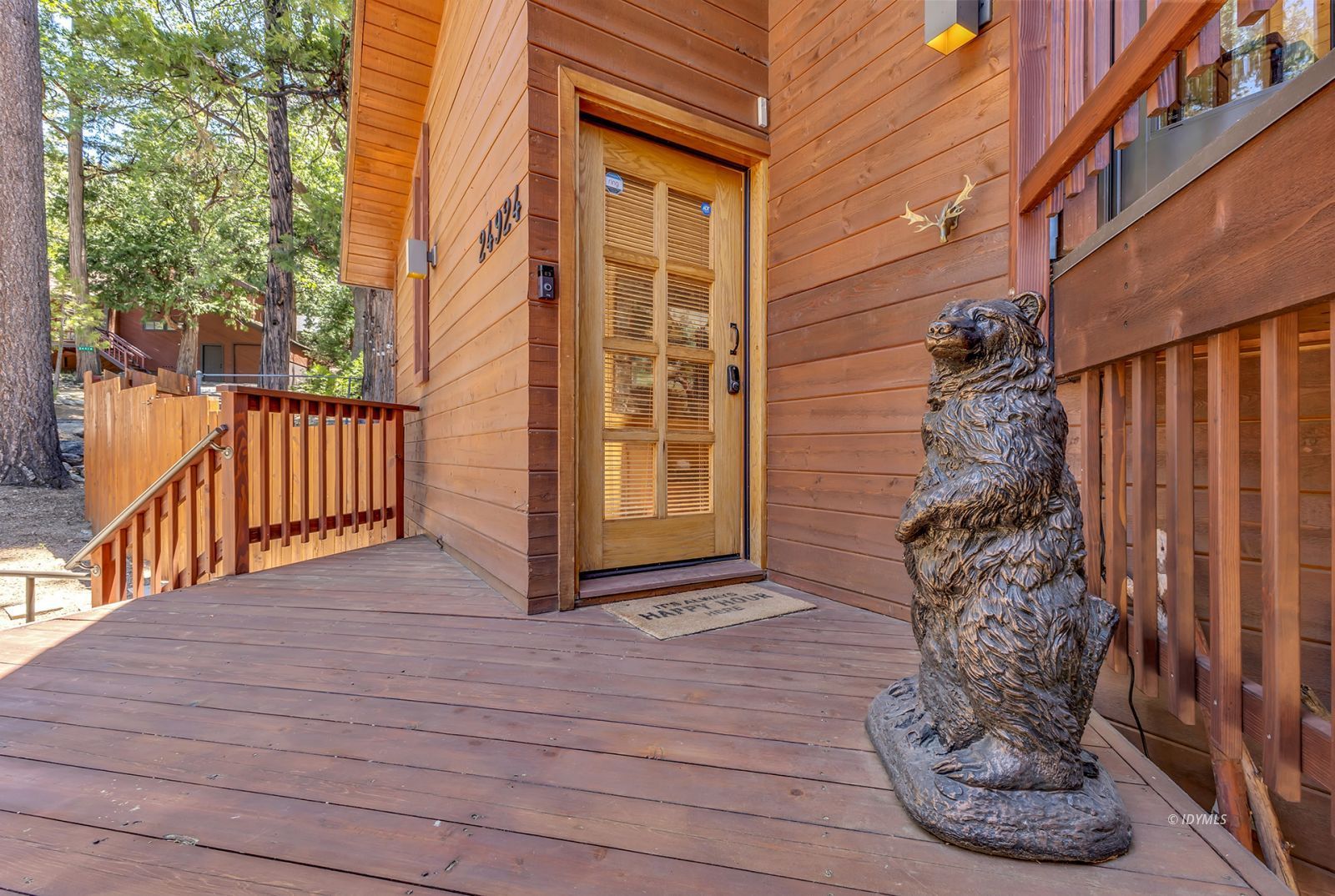 24924 Fern Valley Road Idyllwild, CA 92549 - Photo 34 of 72 a view of a porch with wooden floor and a stairs