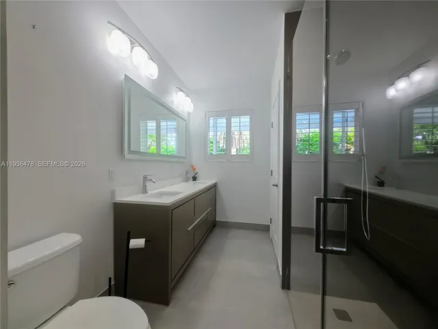 a bathroom with a sink a toilet and tub