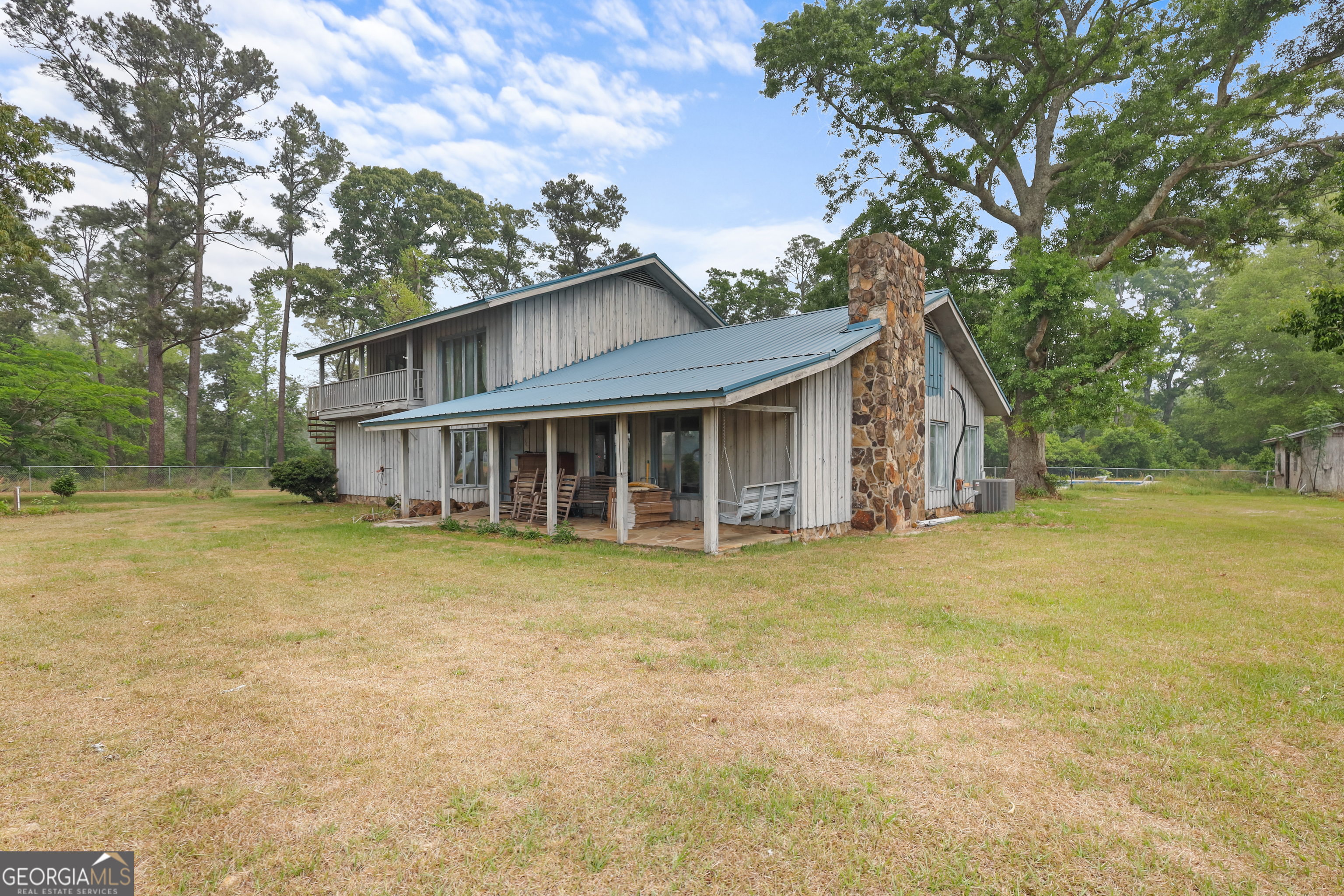 565 Bragg Road Brooklet, GA 30415 - Photo 2 of 44 a front view of a house with a garden