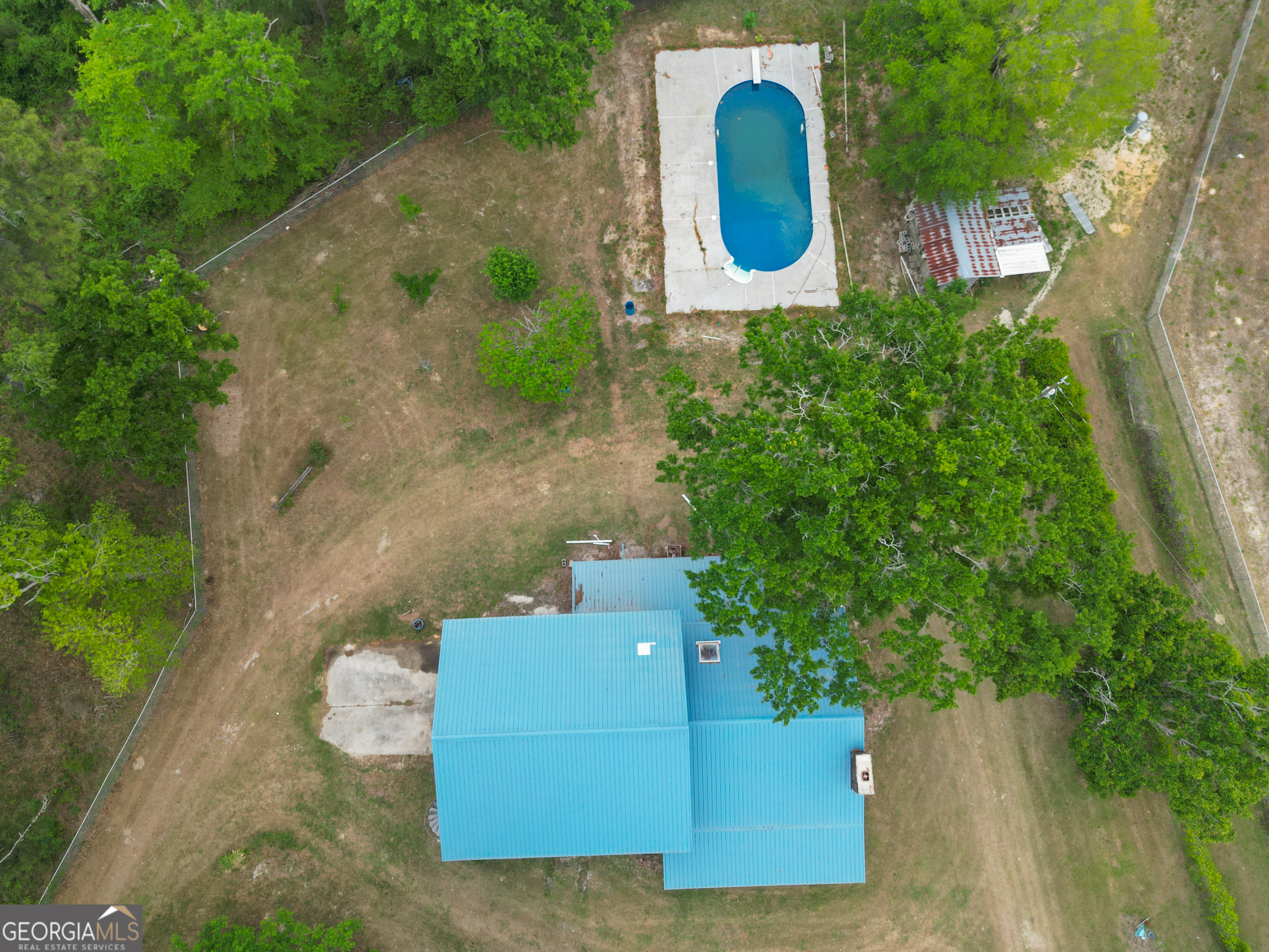 565 Bragg Road Brooklet, GA 30415 - Photo 32 of 44 an aerial view of a house with garden space and trees
