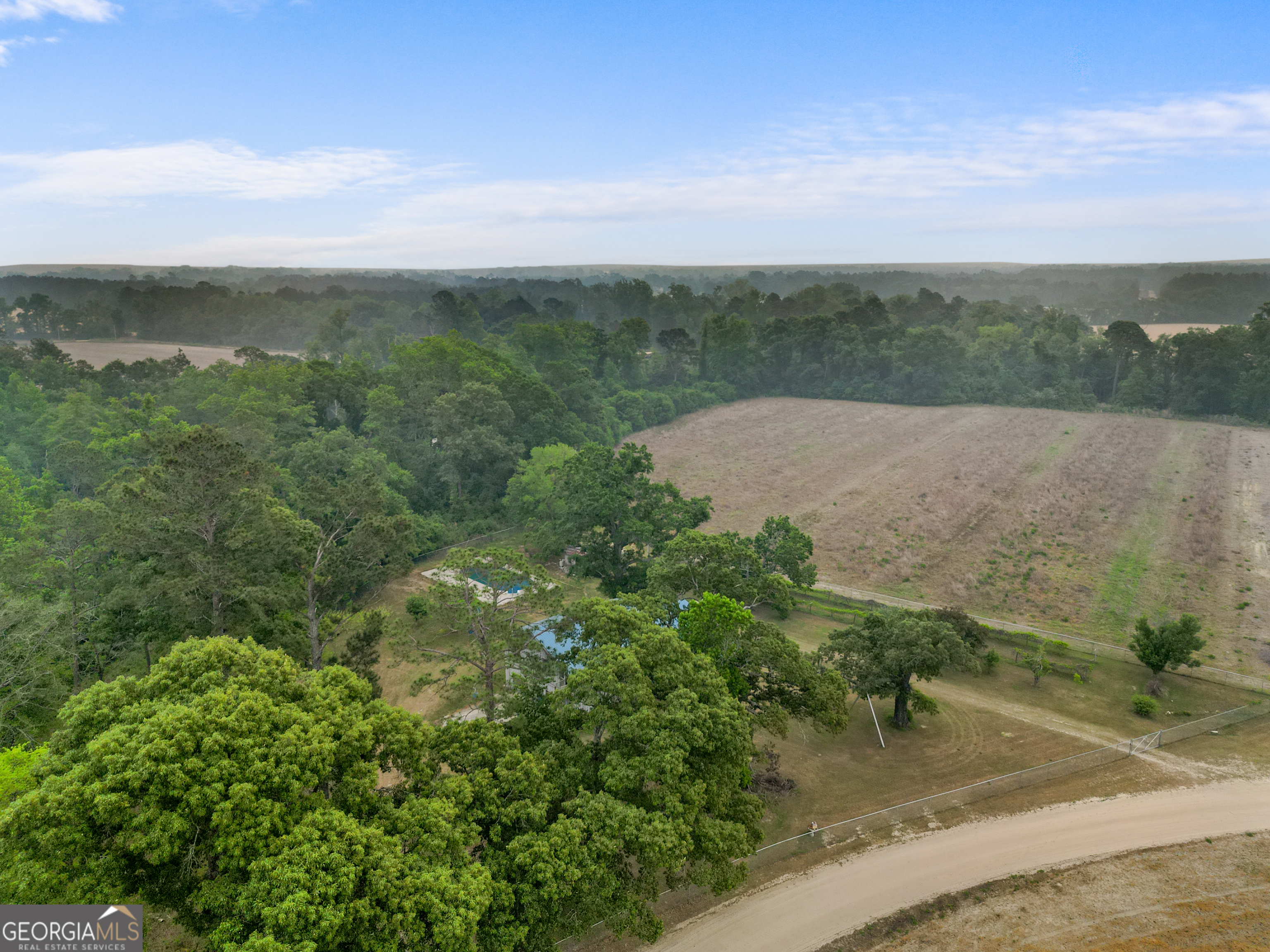 565 Bragg Road Brooklet, GA 30415 - Photo 37 of 44 an aerial view of a house with a yard