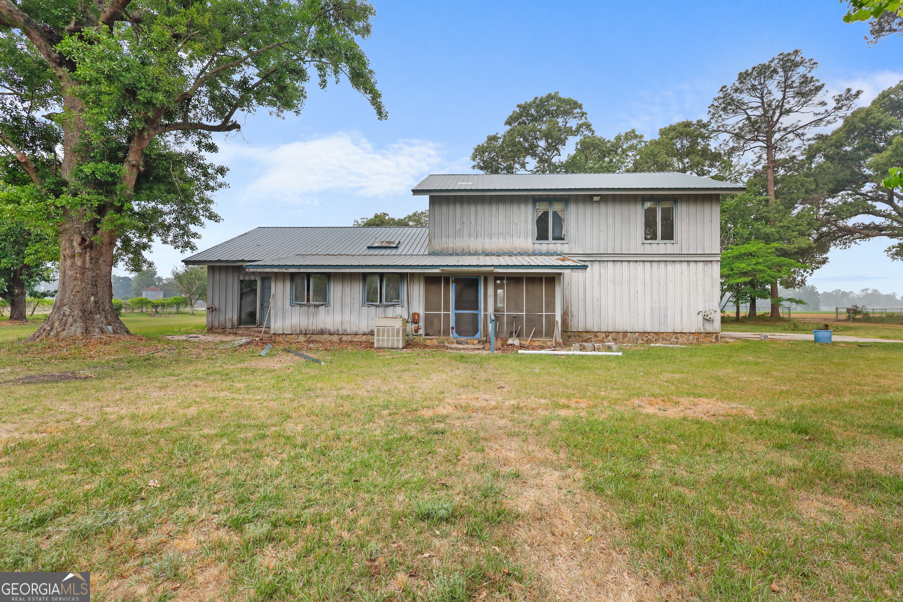 565 Bragg Road Brooklet, GA 30415 - Photo 4 of 44 a front view of a house with a garden