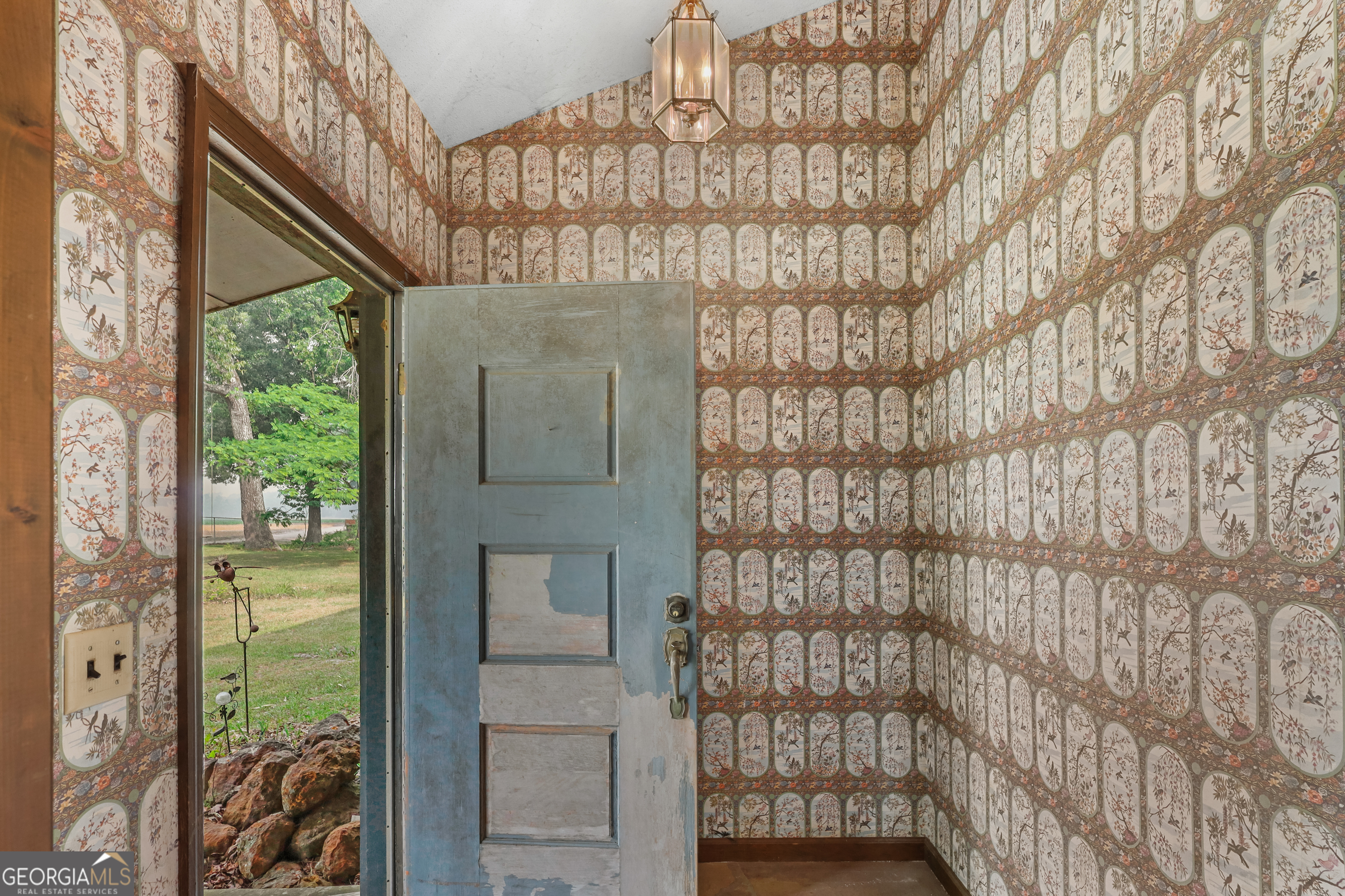 565 Bragg Road Brooklet, GA 30415 - Photo 5 of 44 a bathroom with a shower curtain