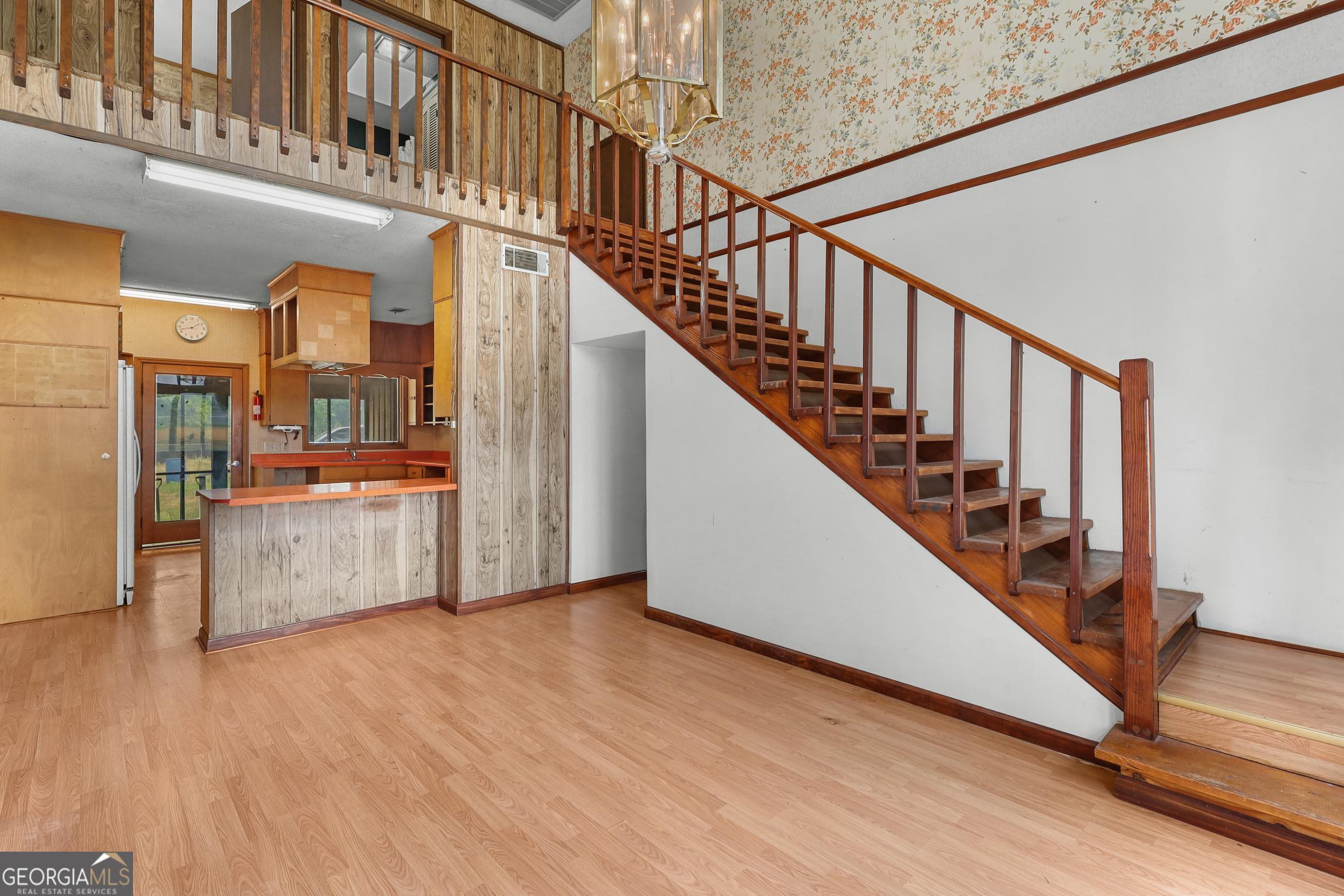 565 Bragg Road Brooklet, GA 30415 - Photo 10 of 44 a view of a hallway with entryway and wooden floor