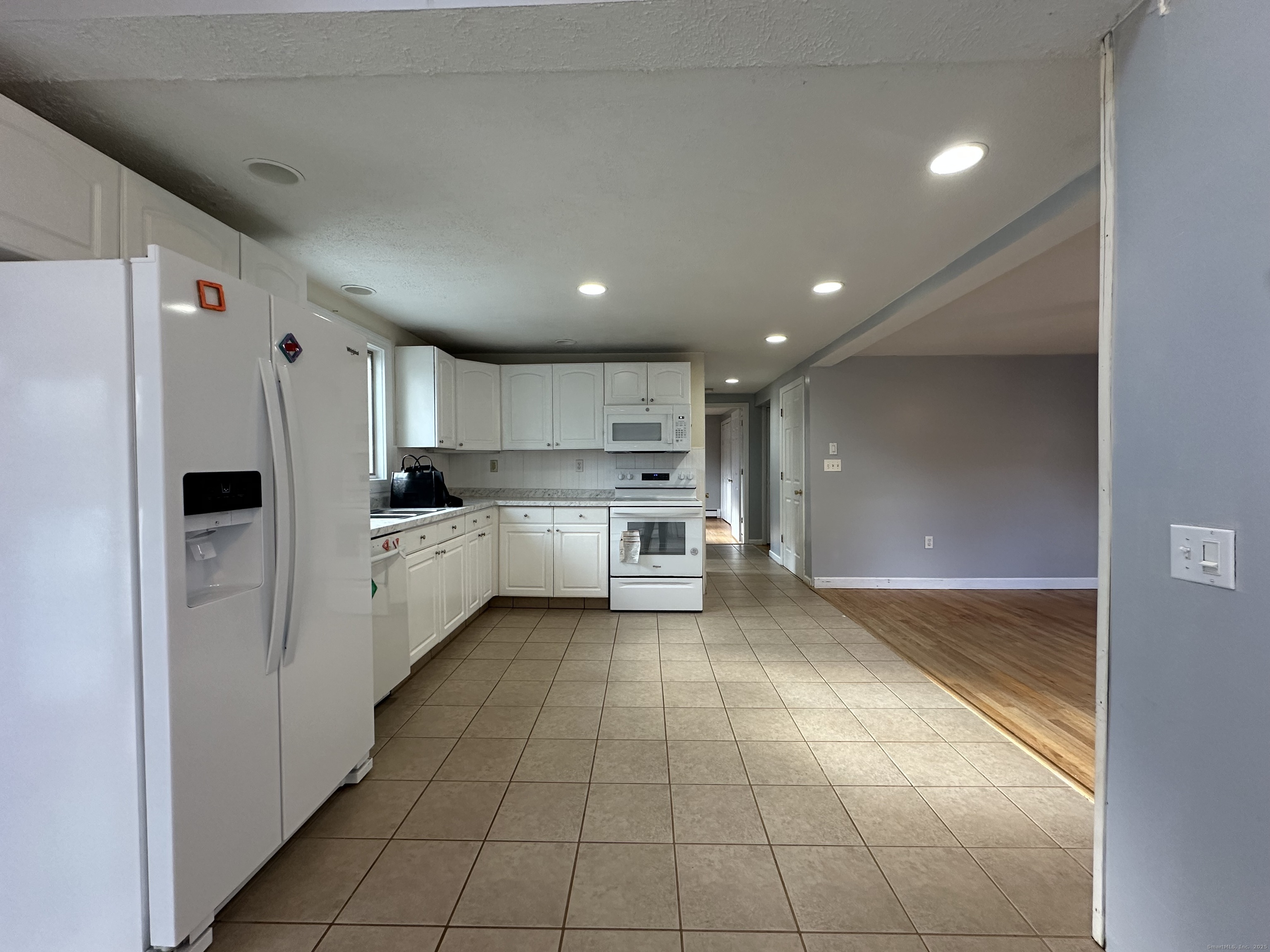 87 Scoville Road Avon, CT 06001 - Photo 5 of 16 a kitchen with stainless steel appliances a refrigerator sink and cabinets