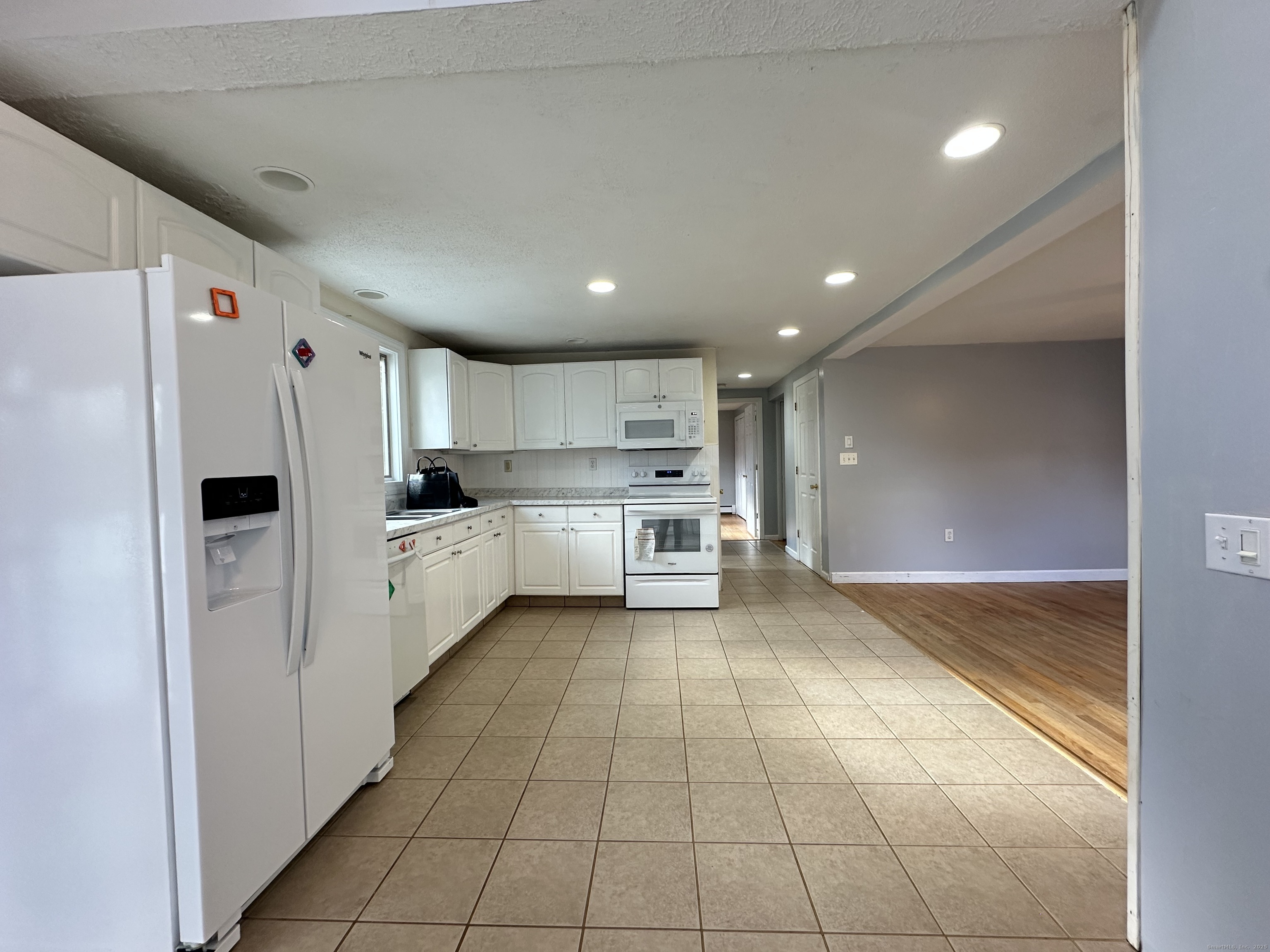 87 Scoville Road Avon, CT 06001 - Photo 6 of 16 a kitchen with stainless steel appliances a refrigerator sink and cabinets
