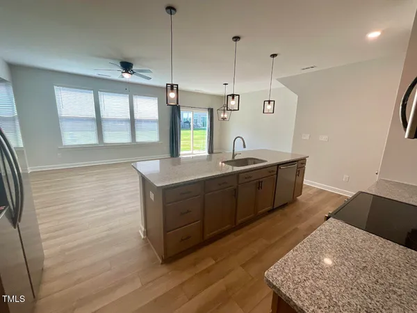 a kitchen with sink and window