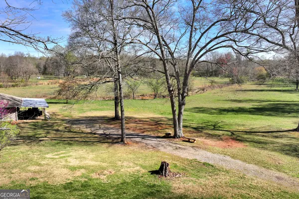 a view of a balcony with lawn chairs
