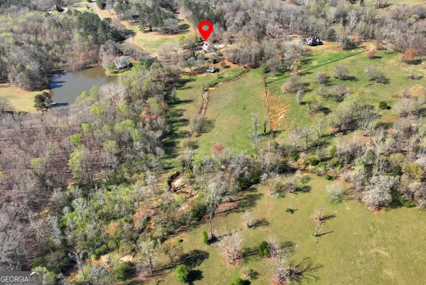 a living room with furniture a fireplace and window