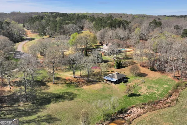 a living room with furniture a fireplace and window