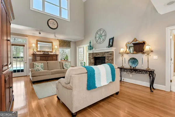 a kitchen with stainless steel appliances granite countertop a sink stove and a refrigerator