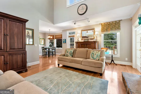 a kitchen with stainless steel appliances granite countertop a stove microwave and cabinets