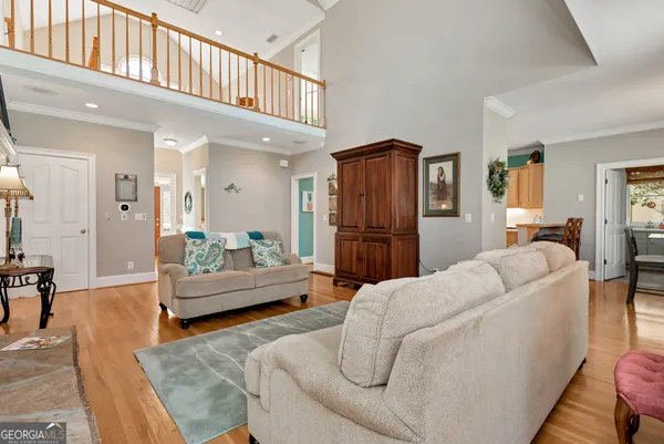 a spacious bathroom with a tub sink and mirror