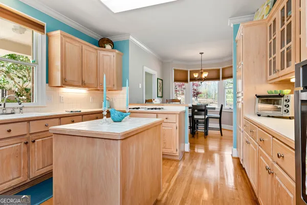 a living room with furniture and a chair