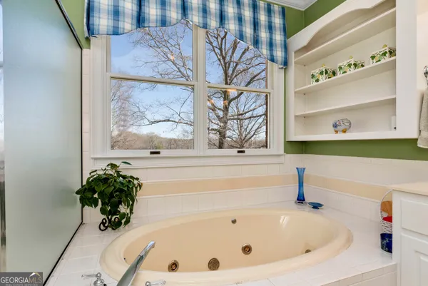 a view of house with yard outdoor seating and covered with snow