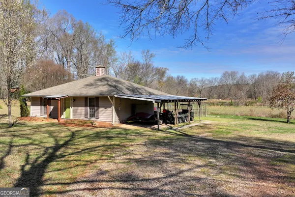 a aerial view of residential houses with yard