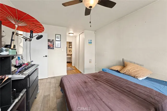 a bedroom with a bed and a closet