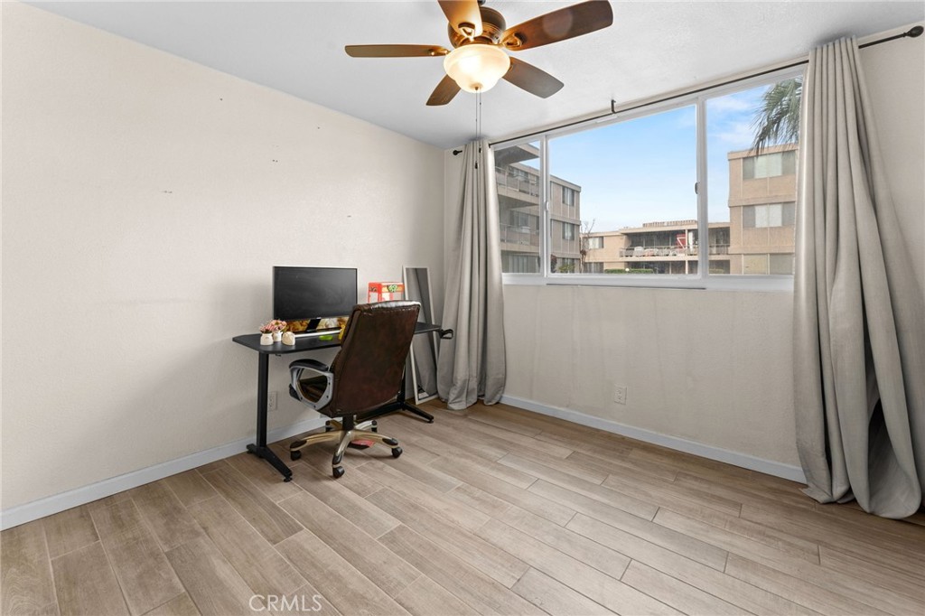 6979 Palm Court Riverside, CA 92506 - Photo 18 of 28 a view of workspace with wooden floor windows
