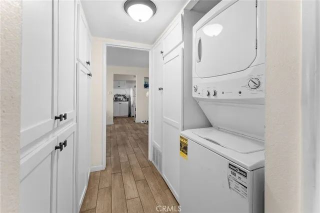 a view of a hallway with washer and dryer