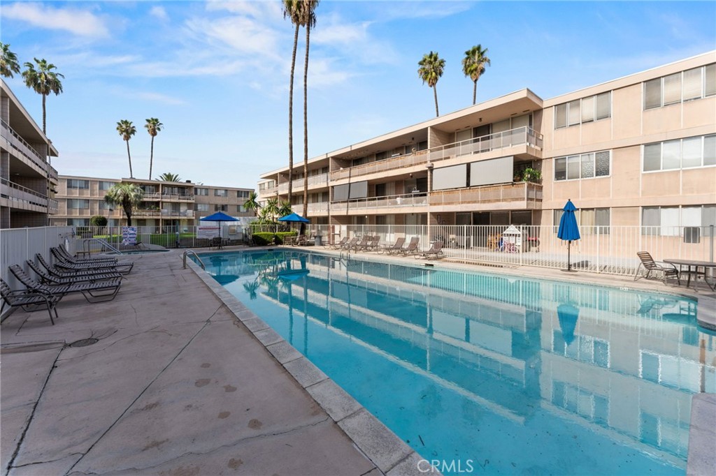 6979 Palm Court Riverside, CA 92506 - Photo 26 of 28 a view of building with yard and balcony