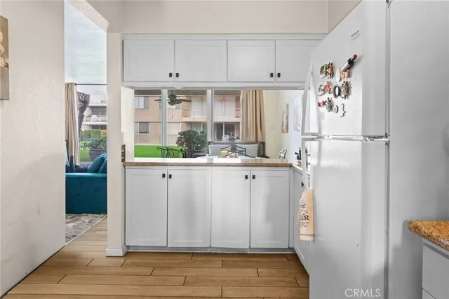 a kitchen with stainless steel appliances a refrigerator and a stove