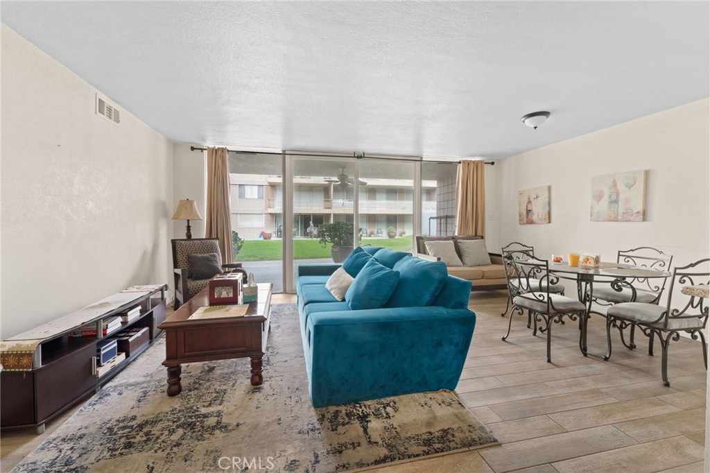 6979 Palm Court Riverside, CA 92506 - Photo 8 of 28 a living room with furniture and a large window