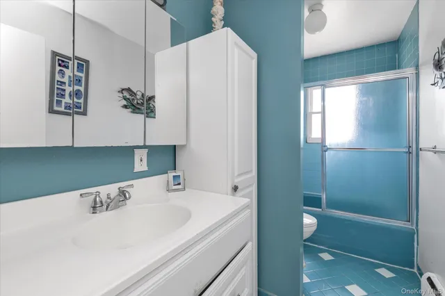 a bathroom with a bathtub a sink and a shower