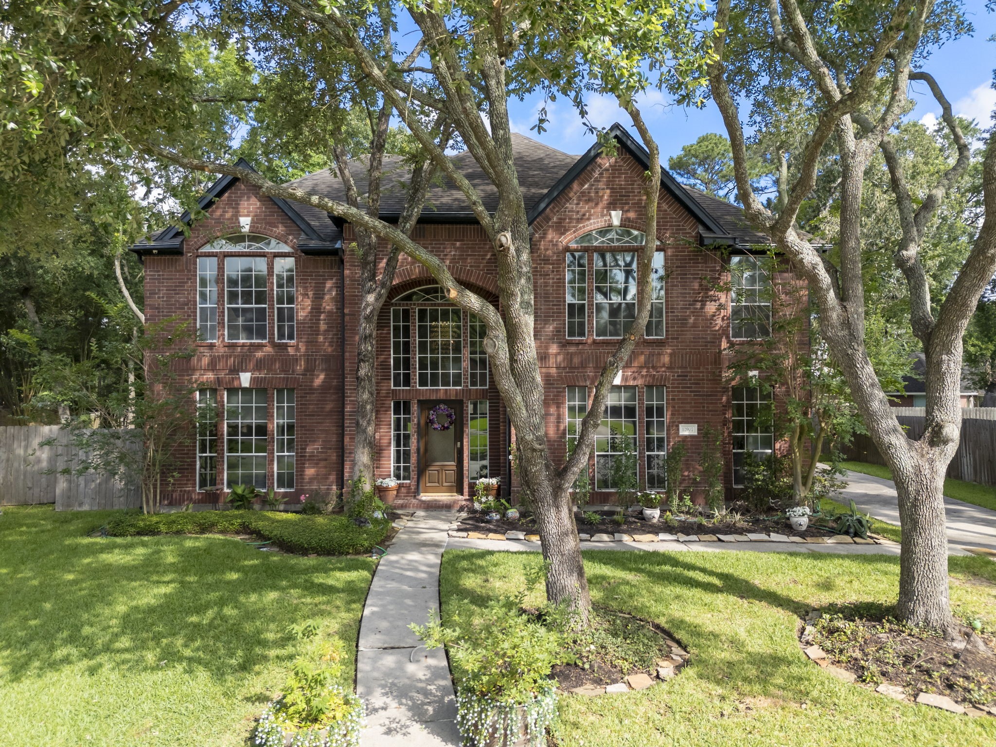 12907 Ryaneagles Circle Houston, TX 77044 - Photo 1 of 48 a front view of a house with a yard