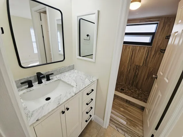 a bathroom with a sink and a mirror
