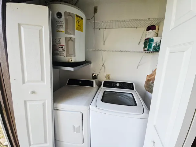 a utility room with dryer and washer