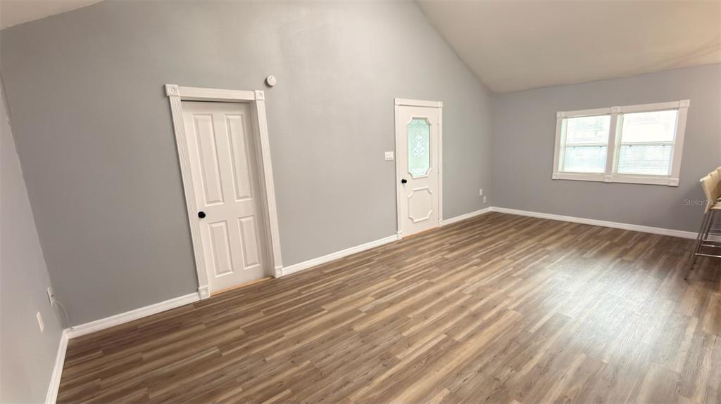 14740 Johns Road Dade City, FL 33525 - Photo 26 of 46 a view of a room with wooden floor and a window