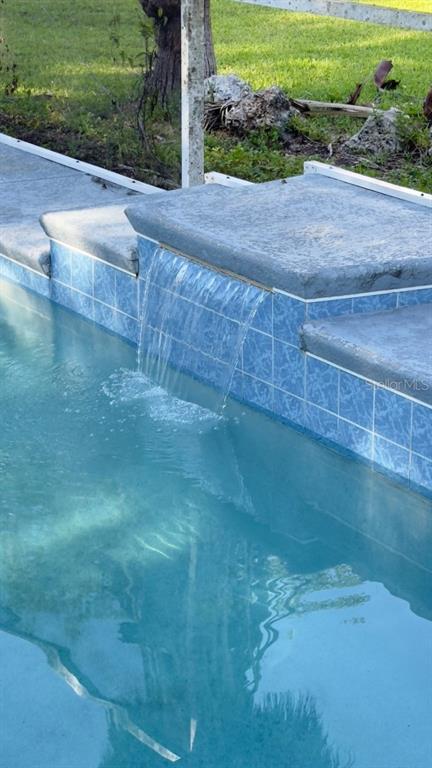 14740 Johns Road Dade City, FL 33525 - Photo 34 of 46 a view of a backyard of a house