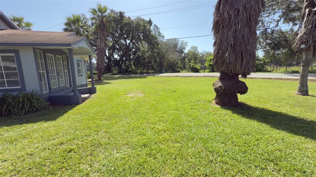 14740 Johns Road Dade City, FL 33525 - Photo 43 of 46 a swimming pool with outdoor seating and yard